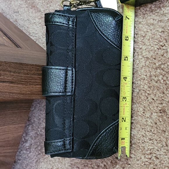 - Coach wristlet black super cute large enough for phone. - Picture 12 of 16